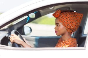 I couldn’t get a man but I now own a Toyota Premio from my new man. 1 24398306 beautiful young african woman driving a car Stock Photo 1024x678 1