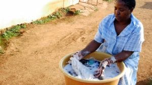 African stock video of a rural woman washing clothes 1 548x308 1