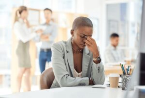 black woman headache stress desk 600nw 2254711261
