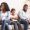 Upset black girl suffer from family conflict, sitting between offended parents, feeling depressed and frustrated.