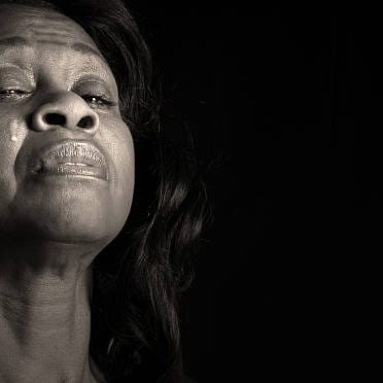 Beautiful middle-aged african american woman shedding tear