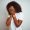 Young african american woman wearing t-shirt standing over isolated white background with sad expression covering face with hands while crying. Depression concept.