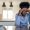 African-american businesswoman, massaging her head, at home