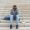 Stressed african-american man sitting alone with headache at university on stairs. Black depressed student guy failed exams, expelled from college, copy space