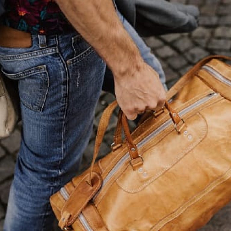 Man carrying bags and luggage