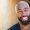 Portrait Of Smiling African American Man Outdoors In Garden At Home