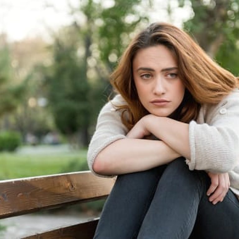 Thoughtful woman in the park