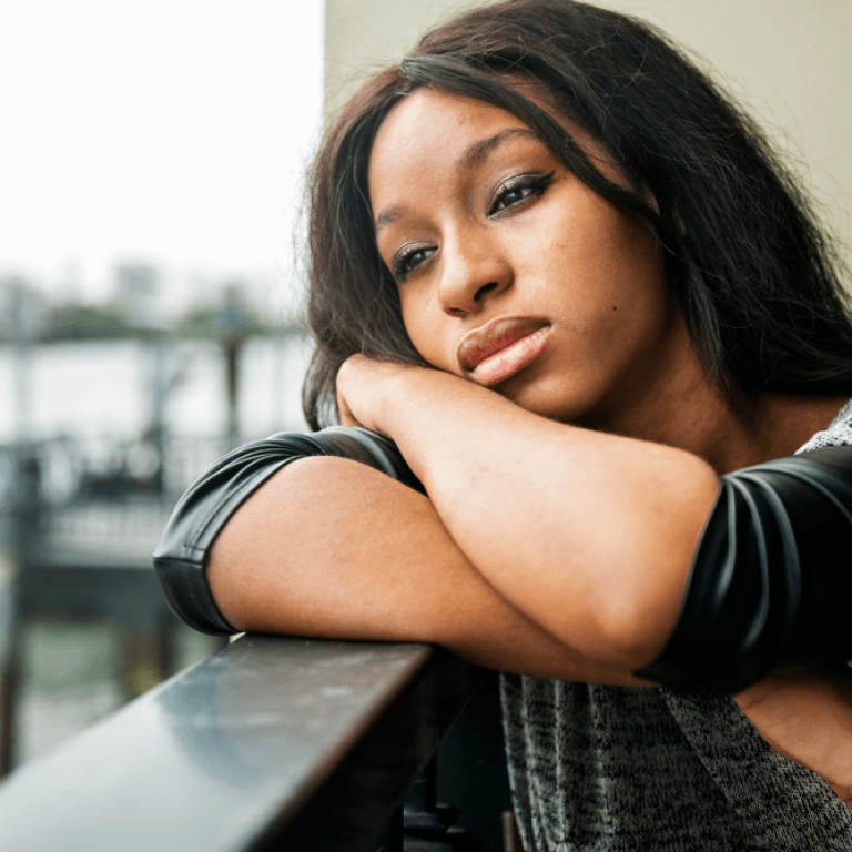 african-american-woman-is-sitting-thoughtfully-2025-02-10-12-44-10-utc