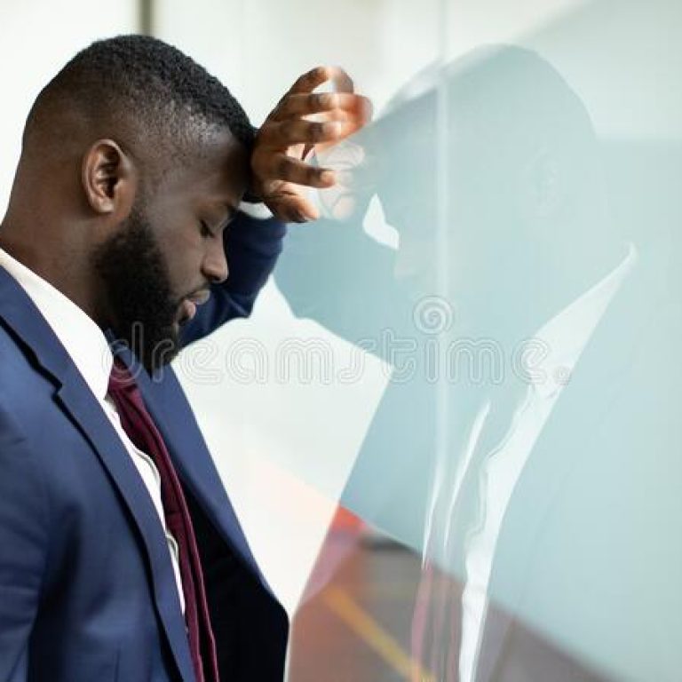 closeup-upset-black-businessman-leaning-glass-wall-closeup-photo-upset-young-black-businessman-leaning-glass-wall-237290577