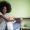 Sad afro woman sitting on a bed