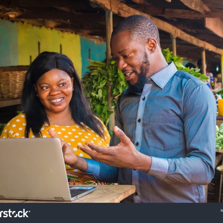 stock-photo-young-black-business-man-explaining-something-to-a-woman-selling-in-a-market-using-a-laptop-1481763479-transformed